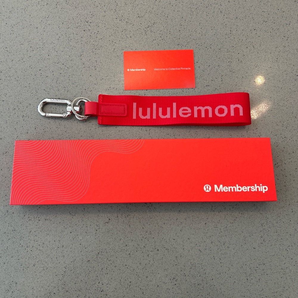 lululemon red branded wrist key strap with metal clip